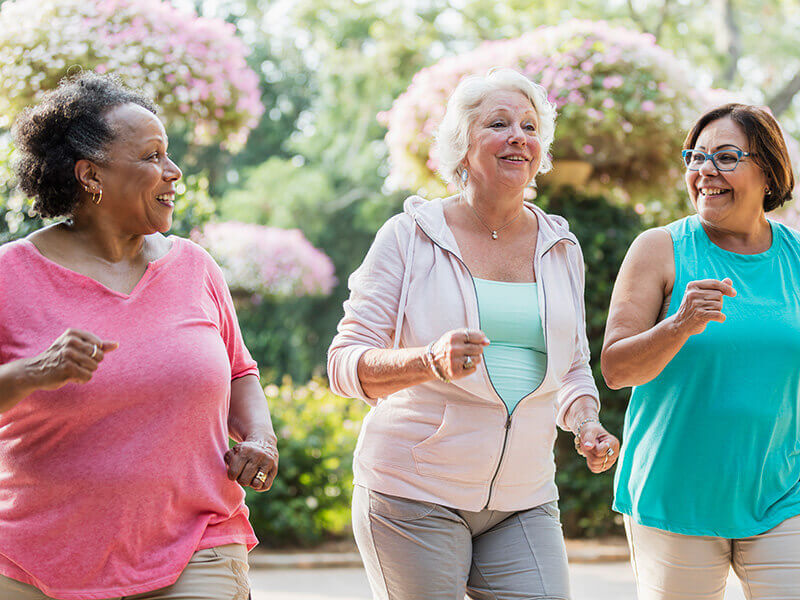 Three women walking outside